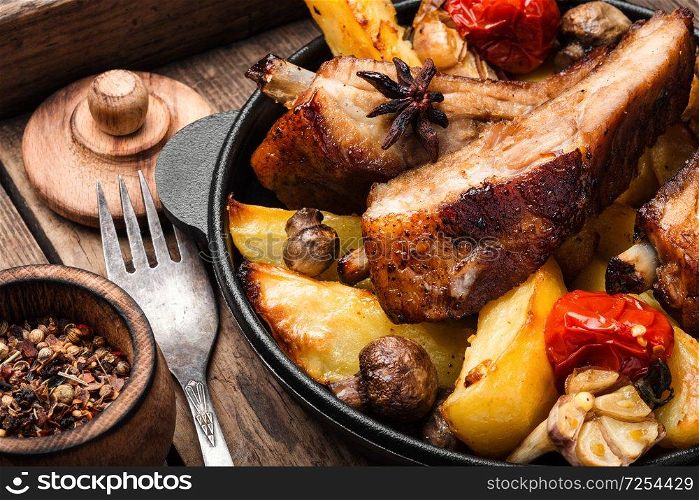 Pan-fried pork ribs and potatoes.American food.Bbq meat,. Sliced barbecue pork ribs