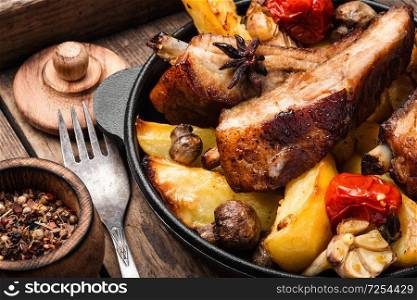 Pan-fried pork ribs and potatoes.American food.Bbq meat,. Sliced barbecue pork ribs