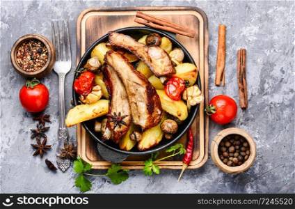 Pan-fried pork ribs and potatoes.BBQ food.American food. Roasted sliced barbecue pork ribs
