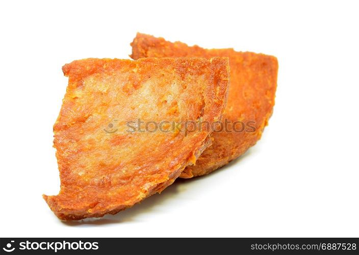 Pan fried slices of luncheon meat isolated on white background