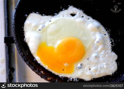 pan full of scramble eggs in a frying pan