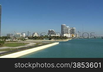 Pan of the Mac Arthur Causeway bridge in Miami connection downtown with Miami Beach.