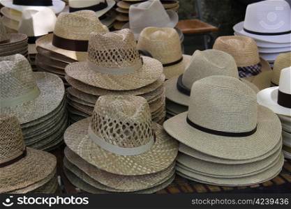 Panama hats in various colors at a market in the Provence, France