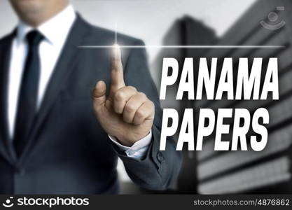 Panama papers touchscreen is operated by businessman. Panama papers touchscreen is operated by businessman.