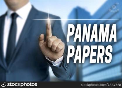 Panama papers touchscreen is operated by businessman.. Panama papers touchscreen is operated by businessman