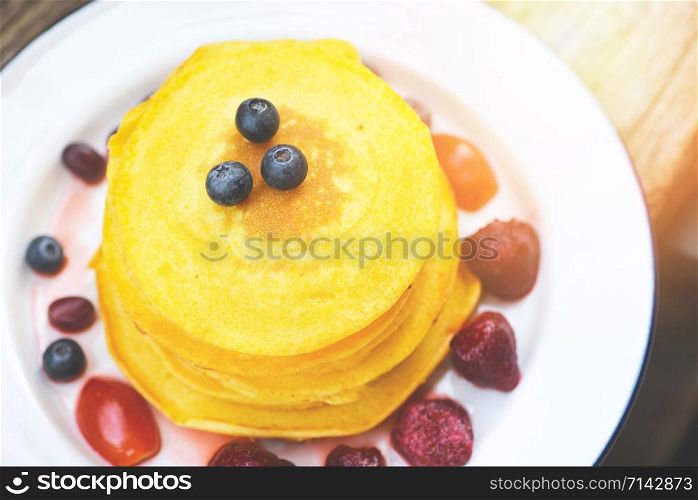 Pancake breakfast homemade healthy food / pancake fruit salad with sweet sauce on plate , top view