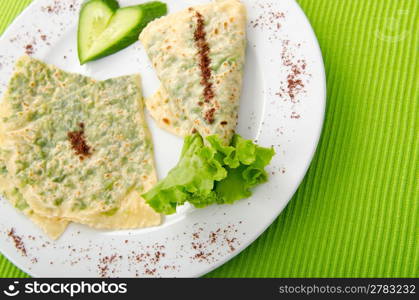 Pancake with herbs in the plate