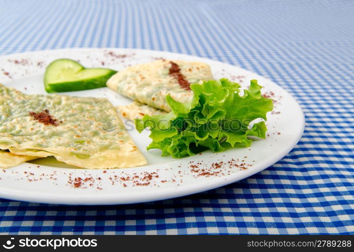 Pancake with herbs in the plate