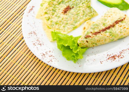 Pancake with herbs in the plate