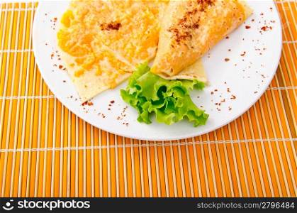 Pancake with pumpkin in plate