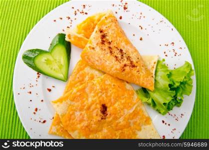 Pancake with pumpkin in plate