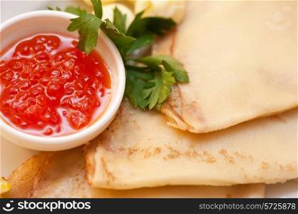 pancake with red caviar closeup