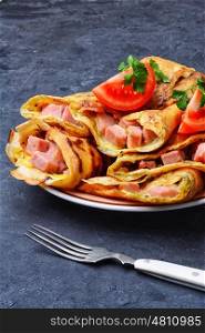 Pancakes for Shrove Tuesday. Tasty pancakes stuffed with meat and mushrooms on the plate