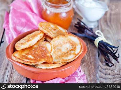 pancakes in bowl and on a table