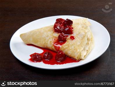 pancakes on plate with sweet cherry confiture