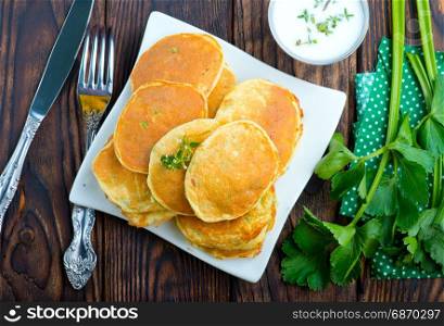 pancakes on white plate and on a table