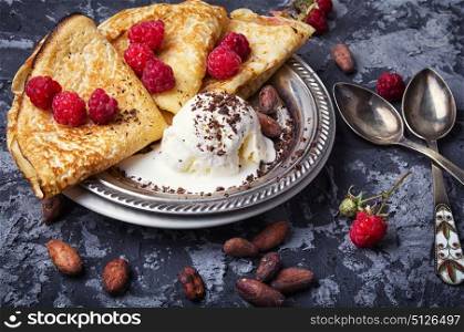 Pancakes with berries. homemade pancakes with raspberries and cocoa beans