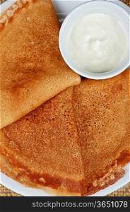 Pancakes with cottage cheese topped with syrup