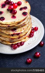 pancakes with cranberry. homemade pancakes stuffed with cranberry on Shrovetide