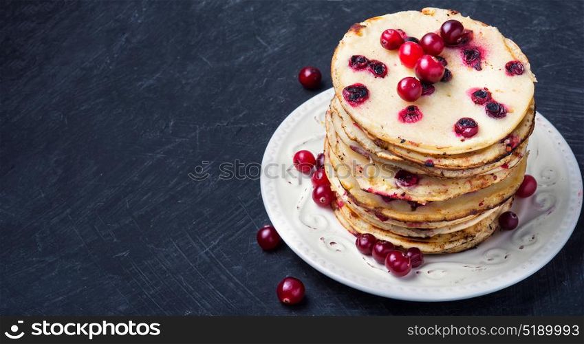 pancakes with cranberry. homemade pancakes stuffed with cranberry on Shrovetide