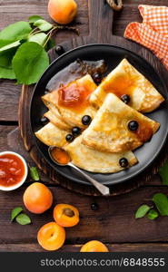 Pancakes with fresh blackcurrant and apricot jam