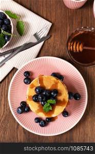 Pancakes with fresh strawberries, blueberries and syrup. Pancakes with fresh berry