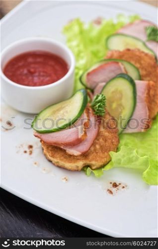 pancakes with ham and cucumber . pancakes with ham and cucumber with tomato sauce and lettuce
