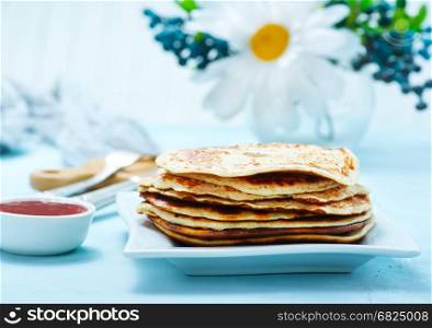 pancakes with honey on the plate