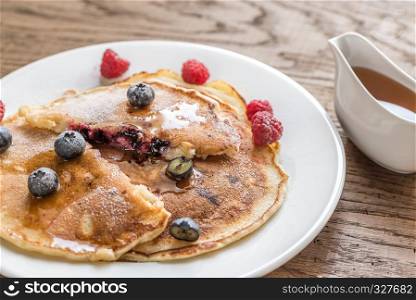 Pancakes with maple syrup and fresh blueberries
