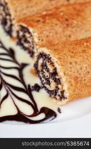 Pancakes with poppy seeds close-up.