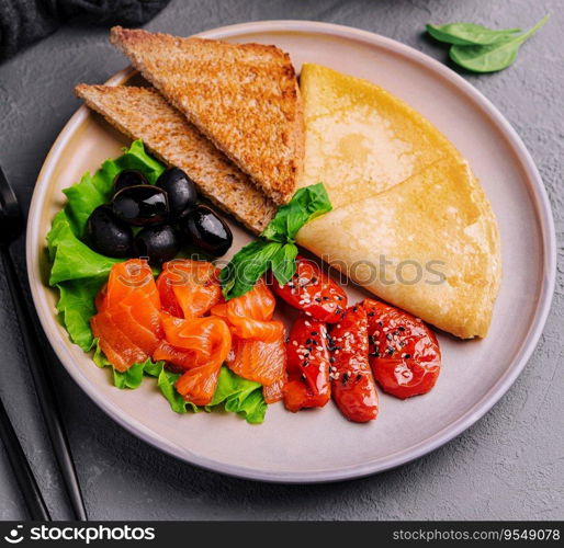 Pancakes with red fish salmon with pepper and olives