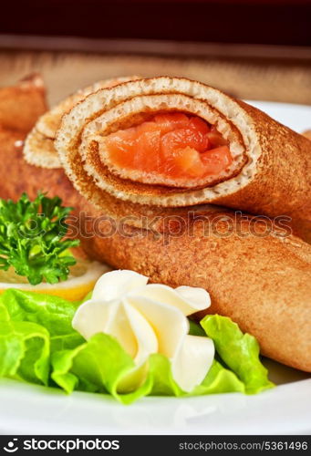 Pancakes with salted red salmon fish