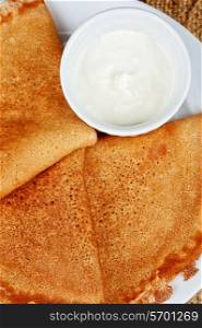 pancakes with sour cream closeup