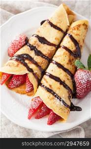 pancakes with strawberry and chocolate sauce