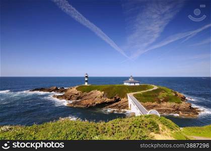 Pancha Island Lighthouse on the coast of Ribadeo, Lugo, Spain.