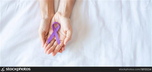 Pancreatic Cancer, testicular, world Alzheimer, epilepsy, lupus and violence day Awareness month, Woman holding purple Ribbon for supporting people living. Healthcare and World cancer day concept
