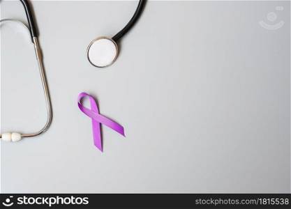 Pancreatic Cancer, world Alzheimer, epilepsy, lupus and domestic violence day Awareness month, Woman holding purple Ribbon with stethoscope. Healthcare and World cancer day concept