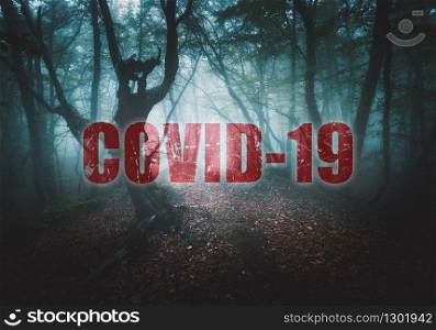 Pandemic of coronavirus. Covid-19 and background with spooky dark forest in fog. Dangerous deadly epidemic of nCoV and scary poster with old foggy trees in fall. Nature and red text. Horror landscape