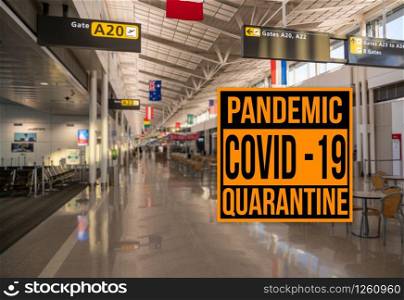 Pandemic sign warning of quarantine due to Covid-19 or corona virus in the USA against background of empty airport terminal. Pandemic sign warning of quarantine due to Covid-19 or corona virus against aiport background