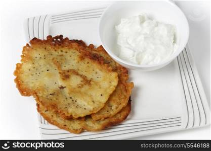 Panella,Italian chickpea pancakes served with a yoghurt dip
