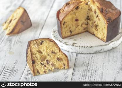 Panettone on the white wooden background: cross section