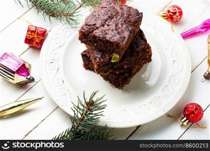 Panforte, cake with almonds, nuts, dried fruits and berries. Christmas pastries or brownie. Panforte, dried fruit and nut cake