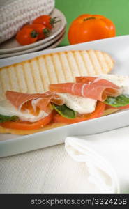 panini sandwich with fresh caprese and parma ham