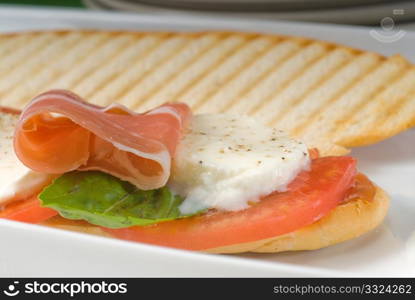 panini sandwich with fresh caprese and parma ham