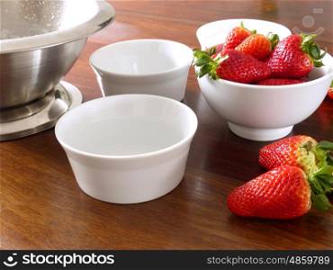 Panna Cotta Ingredients strawberries and white bowls. Panna Cotta Ingredients