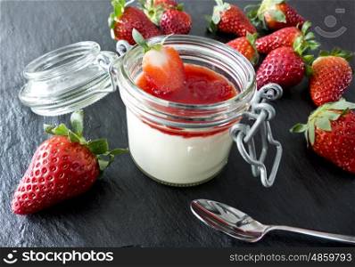 Panna cotta with strawberries in jar&#xD;&#xA;