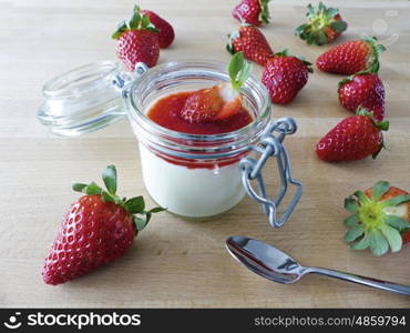 Panna cotta with strawberries in jar&#xD;&#xA;