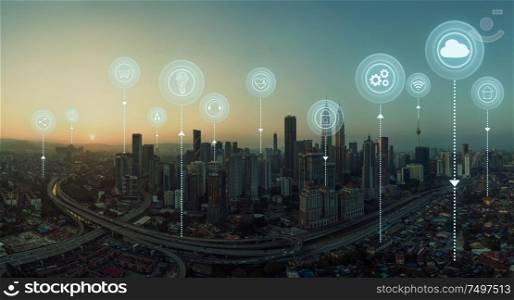 Panorama aerial view in the cityscape skyline with smart services and icons, internet of things, networks and augmented reality concept , early morning sunrise scene .