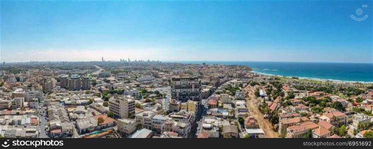 Panorama aerial view of south Tel Aviv neighborhoods and Old Jaffa. A combination of new and old construction. Recognized places such as the Etzel Museum, Old Jaffa Port, Tel Aviv promenade and Neve Tzedek neighborhood.
