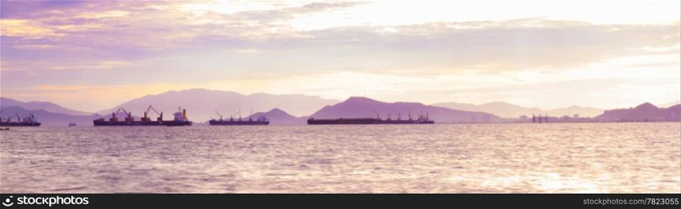 panorama cargo ship in sea at morning.Near the shipping port.